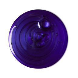 A sample of vibrant, deep purple, Daddy-O shampoo, swirled with tiny bubbles dotted throughout.