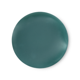 An arial view of teal blue, balm-like Dirty solid perfume.