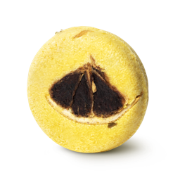 Montalbano. A bright yellow, circular solid shampoo bar, with a quarter slice of lemon pressed into the top.